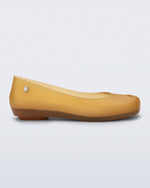 Side view of a clear yellow Ultragirl Futura ballerina flat