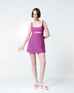 Model in a fuchsia dress wearing a pair of pink Ella sandals