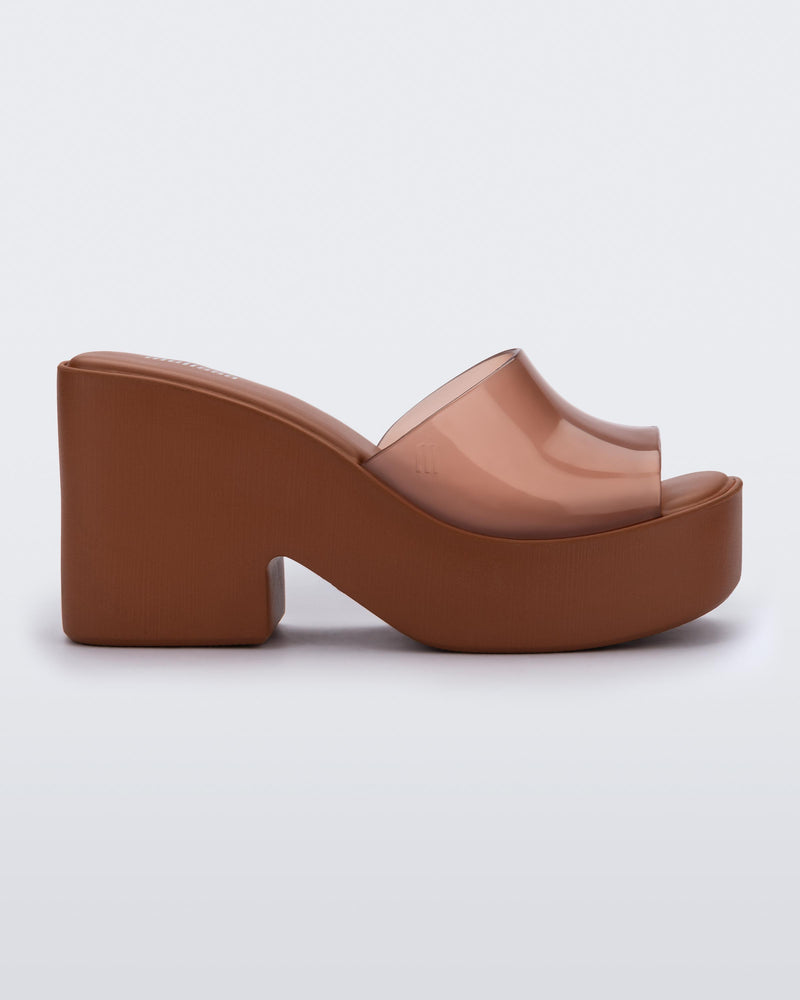 Side view of a transparent brown Posh platform mule