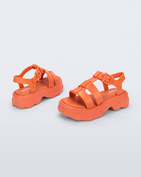 Back and side view of a pair of orange Ella kids sandals