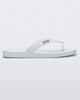 Side view of a white with clear glitter strap Sun Long Beach flip flop