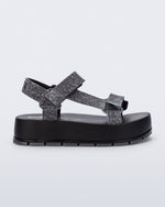 Side view of a black jean Flowing Denim platform