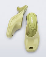 Top and side view of a pair of green Gaia kitten heels with peep toe