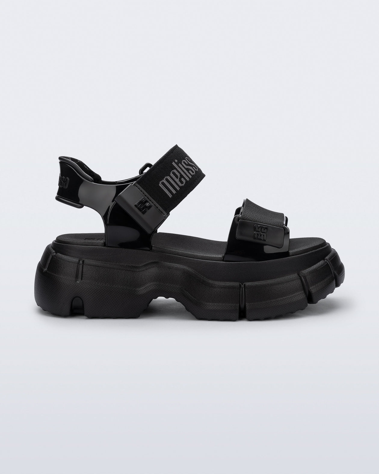 Side view of a black Pulse platform sandal with straps