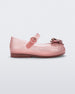 Side view of a glitter pink Mini Melissa Sweet Love Butterfly flat with a top strap and metallic pink butterfly detail on the toe