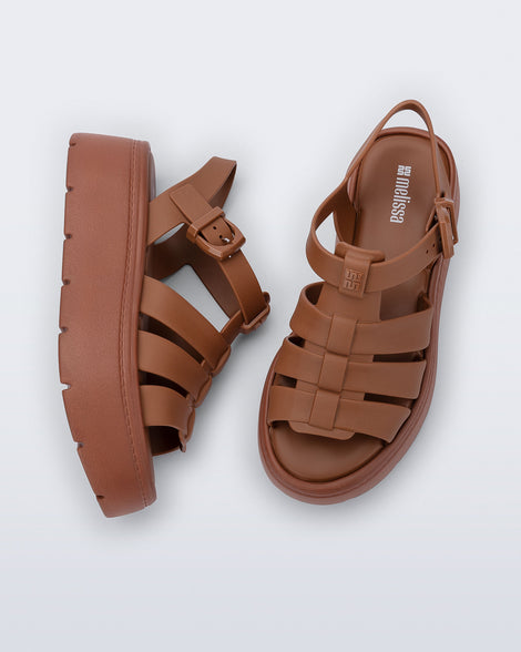 Top and side view of a pair of brown Up Platform sandals