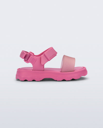 Side view of a pink baby Kick Off Sandal