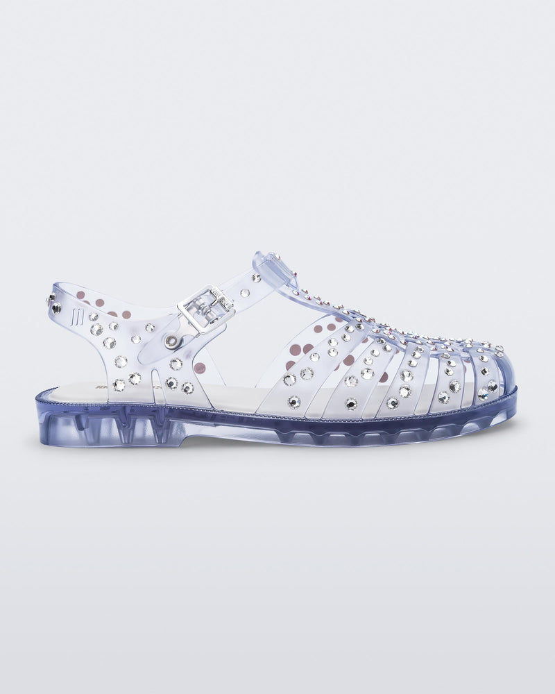 Side view of a clear Possession Crystals sandal