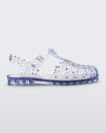 Side view of a clear Possession Crystals sandal