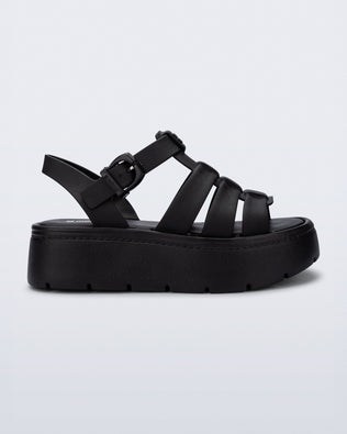Side view of a black Up Platform sandal