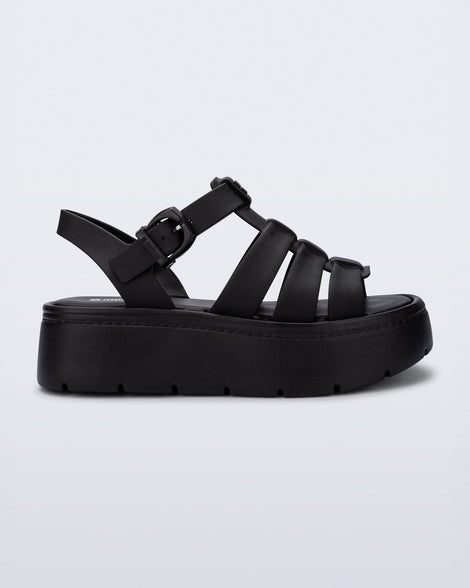 Side view of a black Up Platform sandal