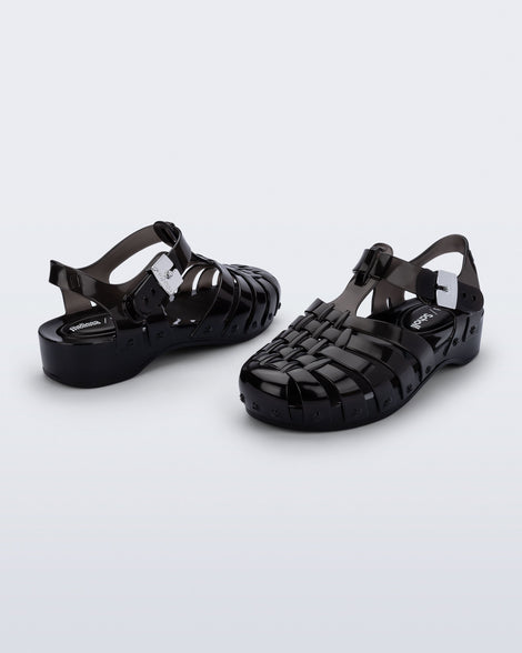 Back and angled view of a pair of black Possession Pescura + Scholl fisherman sandals