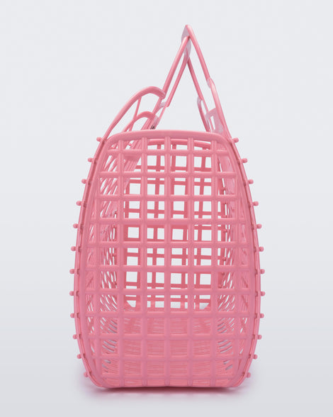 Side view of a pink Refraction bag with handles
