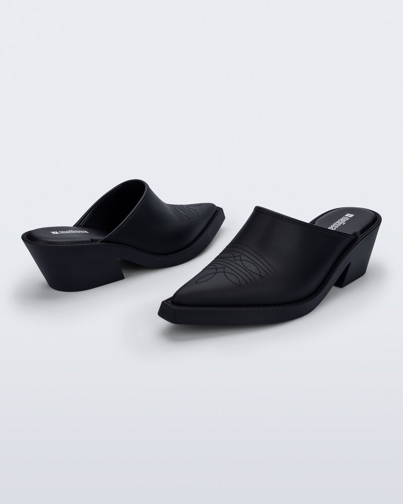 Side and angled view of a pair of matte black Texas Mule heels