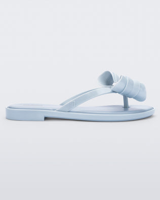 Product element, title Slim Flip Flop in Glitter Blue
 price $79.00