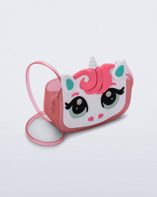 Angled view of a pink glitter Dreamy Unicorn kids bag with a unicorn face on front with pink hair