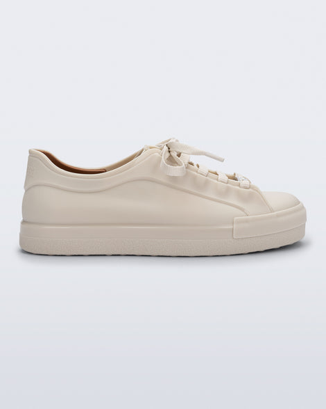 Side view of a beige Wow Sneaker with beige shoe laces