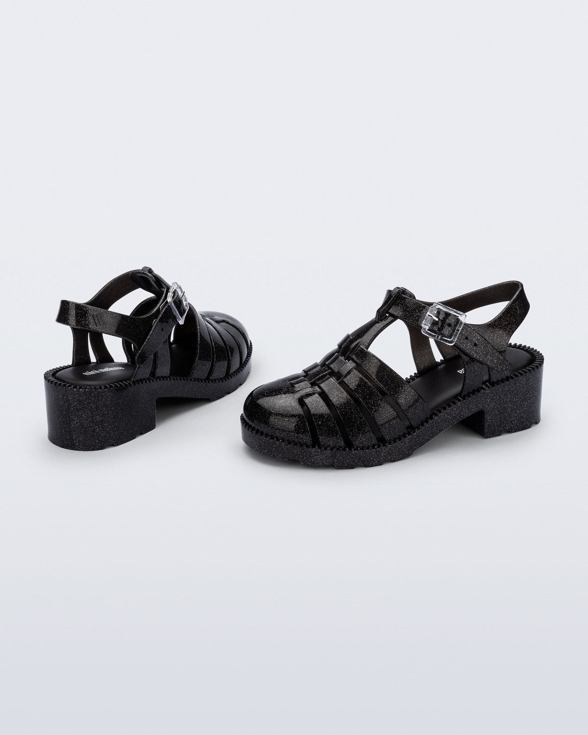Back and side view of a pair of pearly black Possession Heel kids fisherman sandals