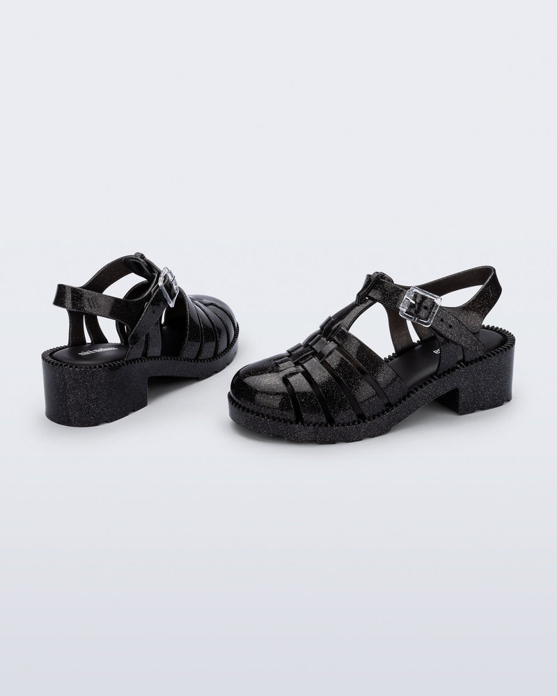 Back and side view of a pair of pearly black Possession Heel kids fisherman sandals