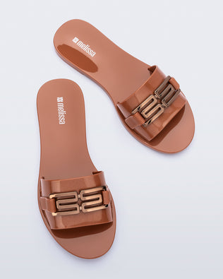 Top view of a pair of brown Babe M Chic slide sandals