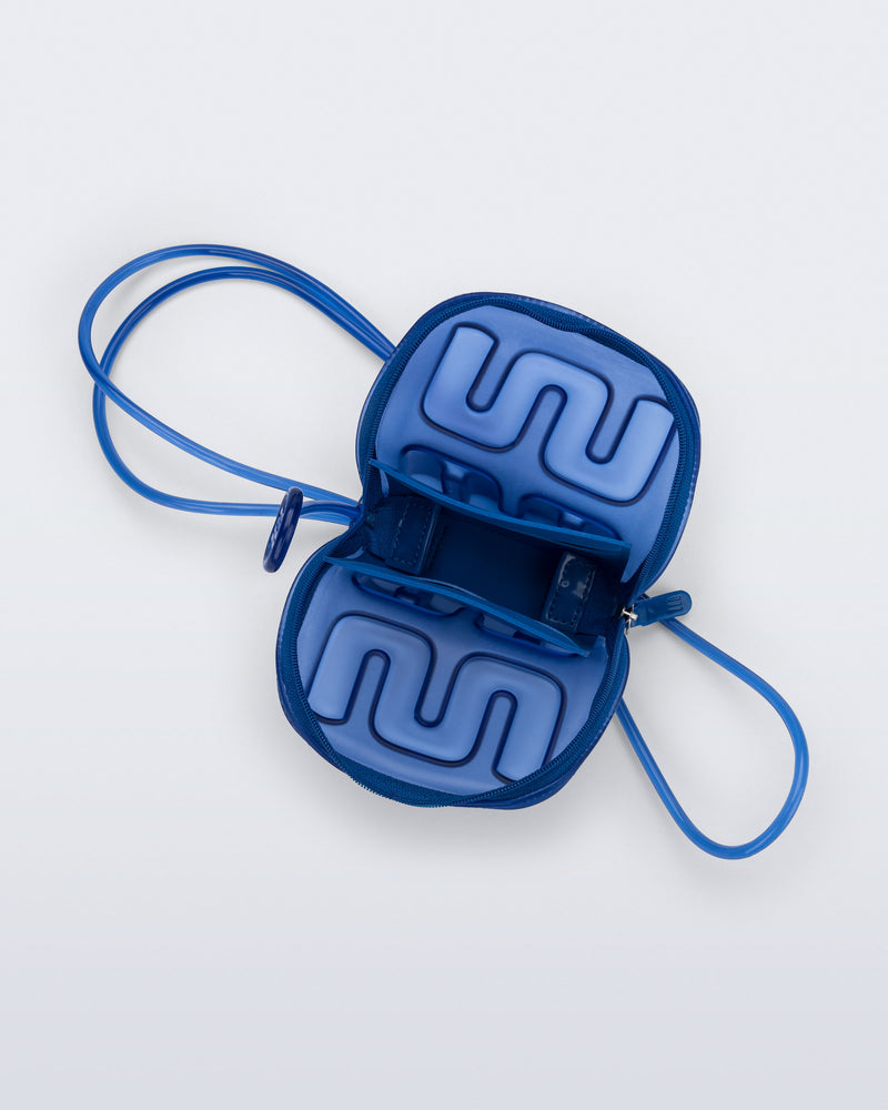 Top view of a blue Jelly Wallet with inside pocket and zipper