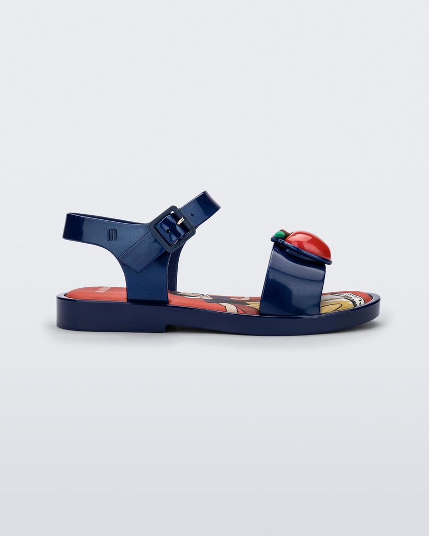 Side view of a metallic blue Mini Melissa Mar Sandal Princess sandal with an apple detail on the front strap, an ankle strap and Princess Snow White soul