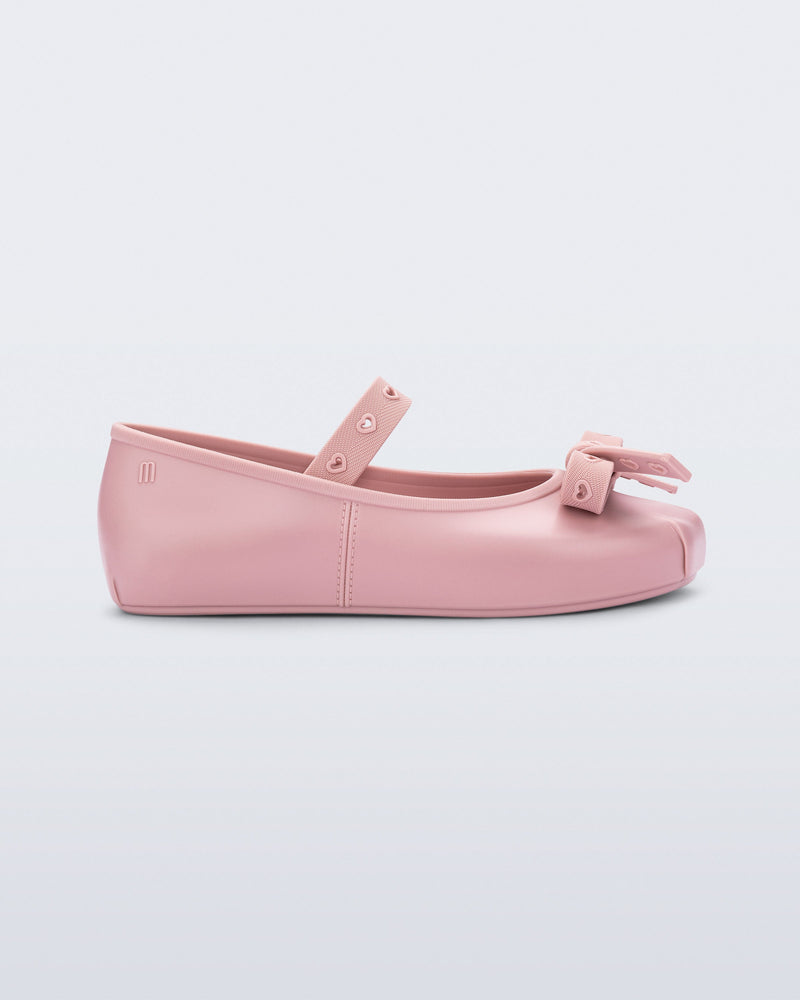 Side view of a pink Sophie Crush kids ballerina flat with bow