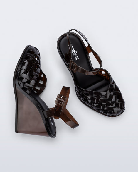 Side and top view of a pair of clear brown Agata wedge heel sandals with ankle strap
