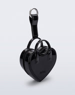 Angled view of a black Heartbeat Pocket bag charm