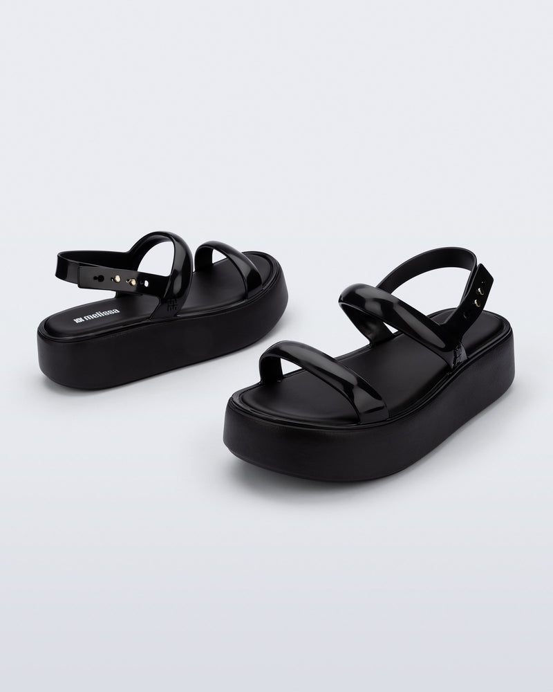 Back and angled view of a pair of black Wave Platform sandals with top and heel straps