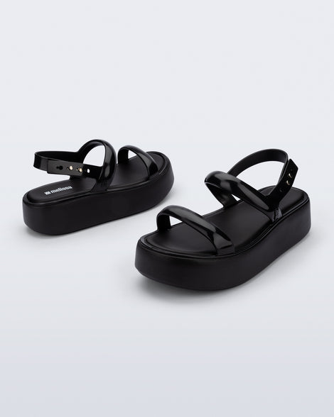 Back and angled view of a pair of black Wave Platform sandals with top and heel straps