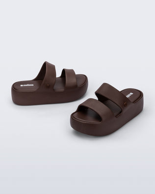 Angled and side view of a pair of brown Free Line Platform slides