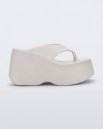 Side view of a beige Free Thong  Wedge Platform heel