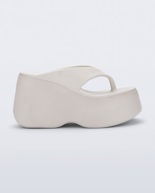 Side view of a beige Free Thong  Wedge Platform heel