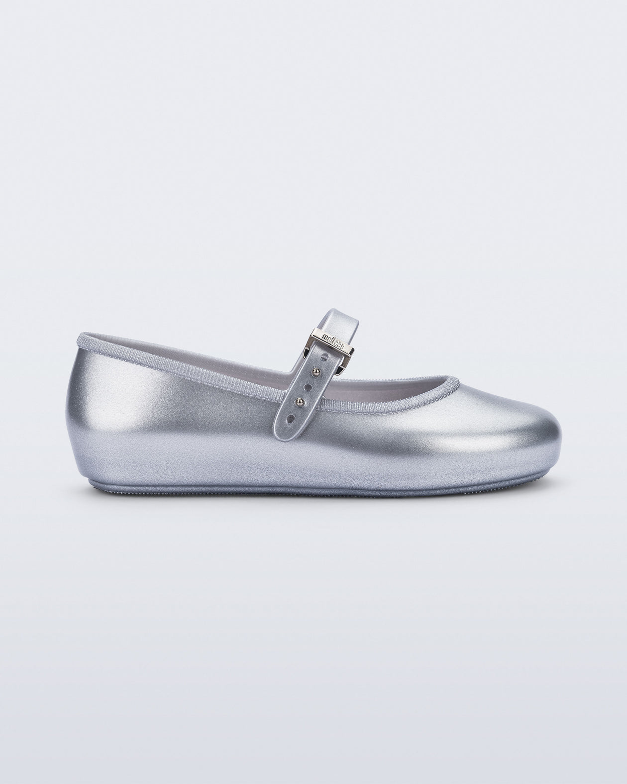 Side view of a pair of silver Soft Ballerina kids flat