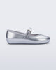 Side view of a pair of silver Soft Ballerina kids flat