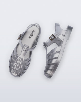 Top and side view of a pair of magic silver Possession Fisherman sandals