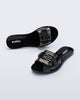 Top and angled view of a pair of black Babe M Chic slide sandals