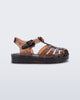 Side view of a clear brown Possession baby sandal