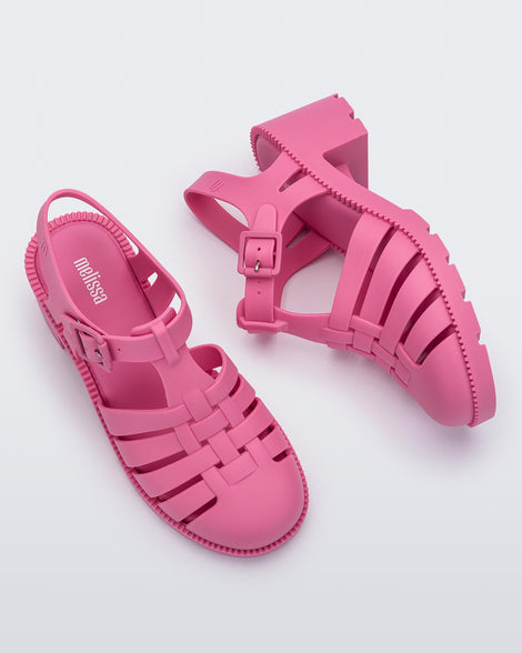 Side and top view of a pair of pink Possession Heel women's fisherman style sandals.