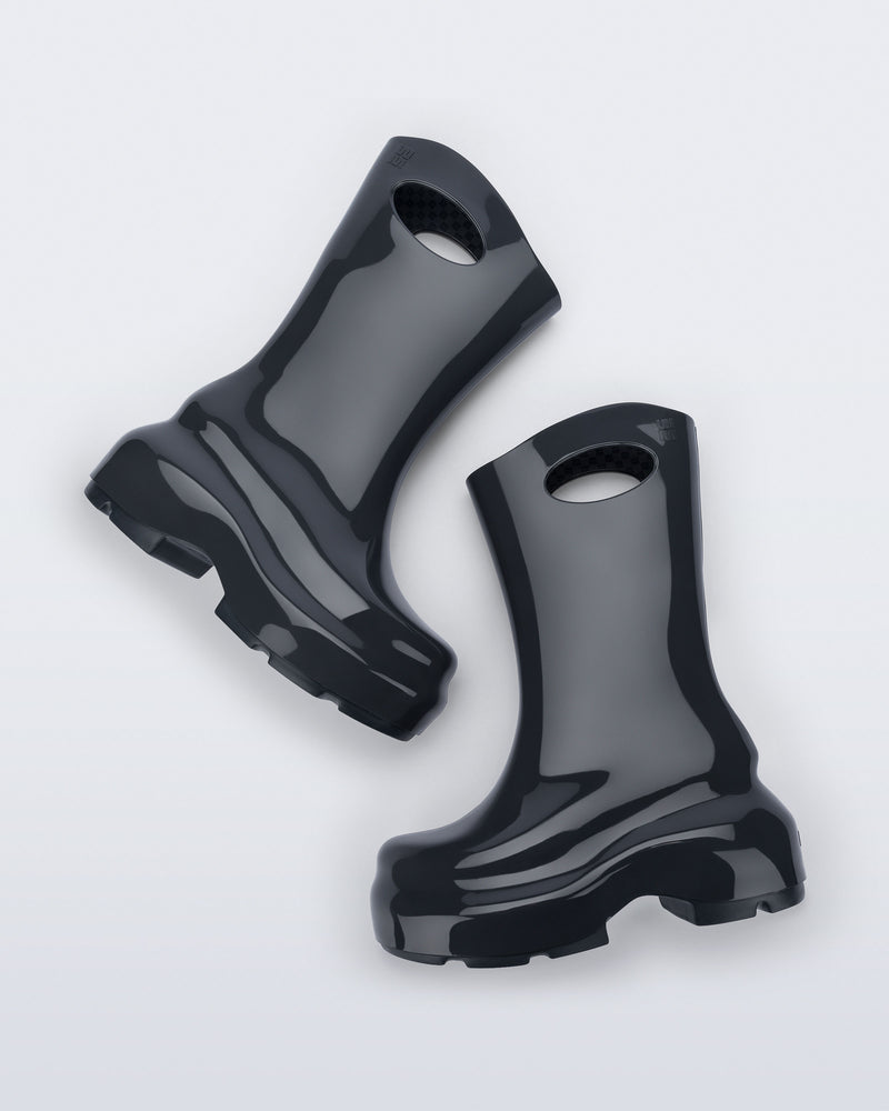 Top view of a pair of grey Ultra platform rain Boot with circle cutout on top