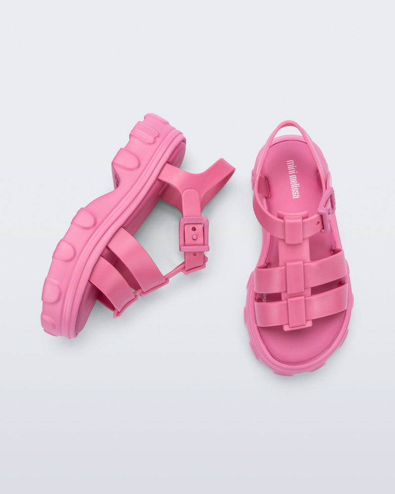 Top and side view of a pair of pink Ella kids sandals