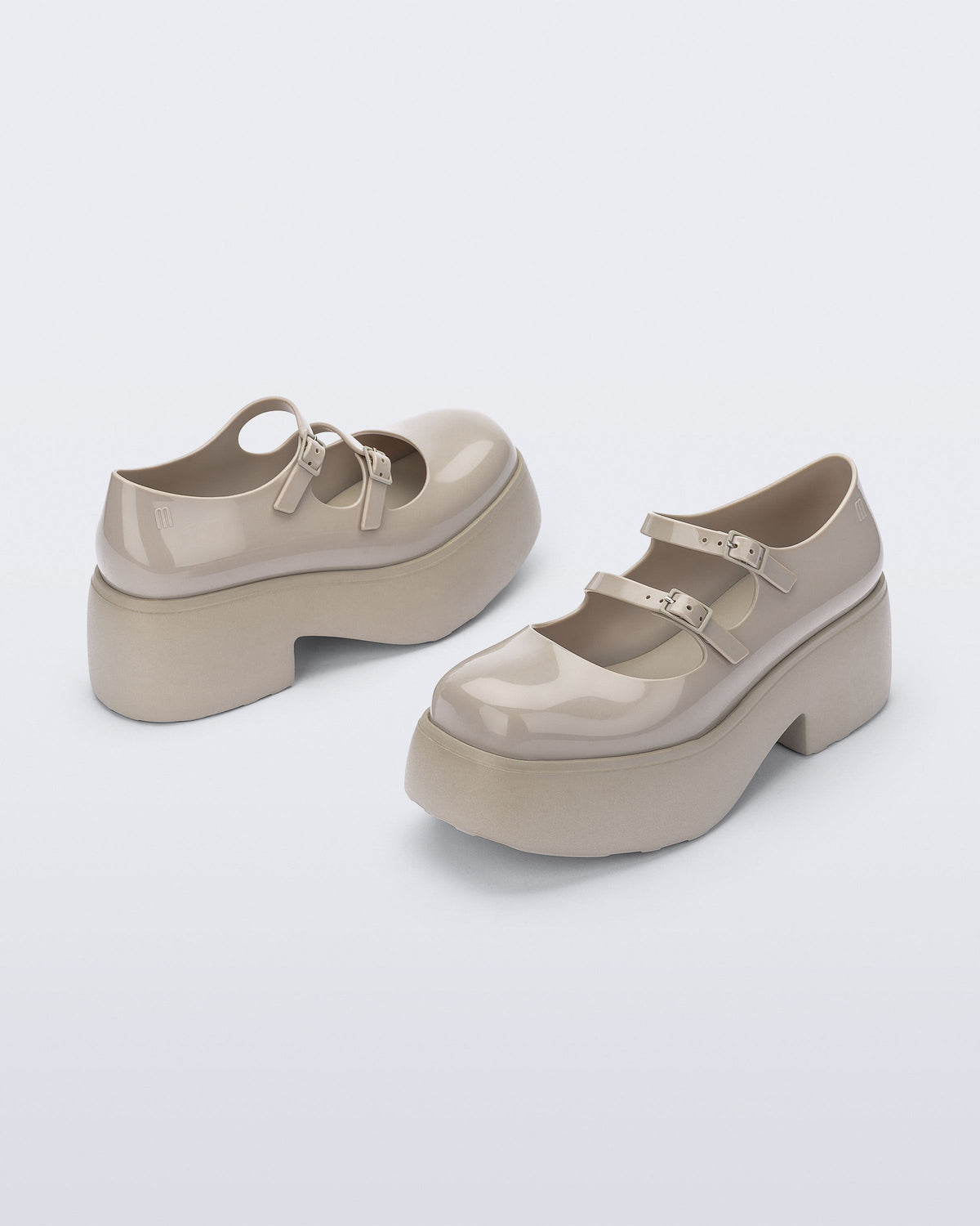 Back and front angled view of a pair of beige Farah platform mary janes