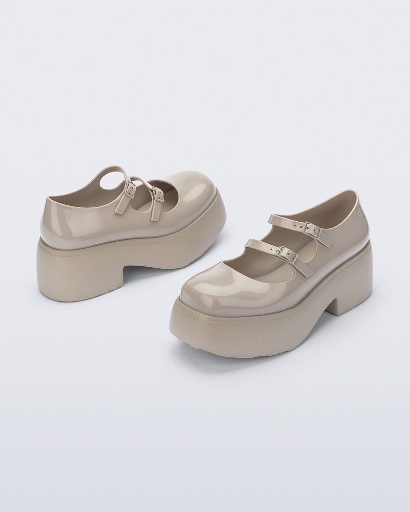 Back and front angled view of a pair of beige Farah platform mary janes