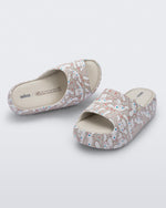 Top and angled view of a pair of beige Hello Kitty + Friends Free Platform with Hello Kitty and Friends print