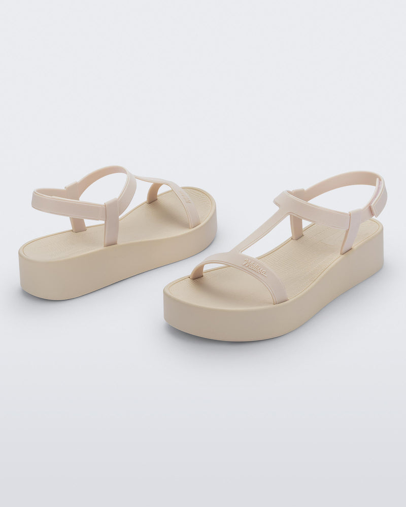 Back and angled view of a pair of beige Sun Capri Platform sandals with ankle straps