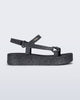 Side view of a black glitter Sun Downtown Platform sandal