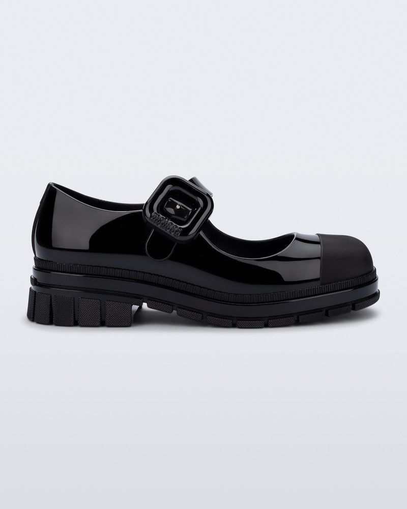 Side view of a black June mary jane with matte toe cap