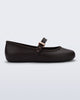 Side view of a brown Soft Ballerina flat with top strap and rose gold buckle