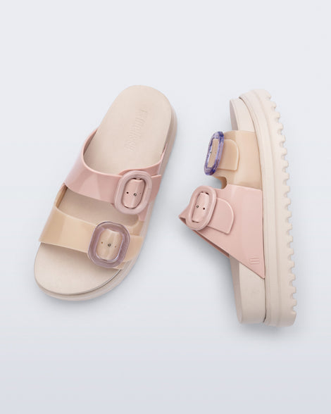 Top and side view of a pair of beige/pink Cozy Platform slide sandals with two buckle straps.